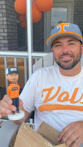 Man holding a personalized mini you statue
