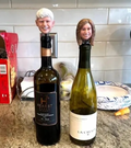 Wine bottles with a custom bobble head stoppers