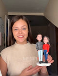 Woman holding custom bobble heads