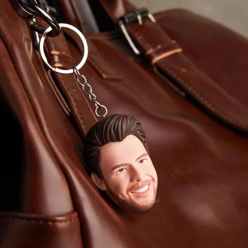 Bobble head keychain on a leather bag