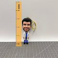 Bobble head keychain with size reference