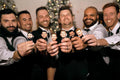 Men showing bobble head gifts